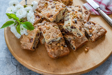 Easter mini chocolate egg traybake with hazelnuts and cranberries cut into squares