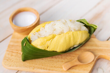 Durian with sweet sticky rice and coconut milk on top (Khao Niao Thu Lien). Thai style tropical dessert, glutinous rice eat with durian. 