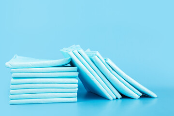 dog nappy, absorbent diaper pad, urine diaper pet napkin on blue background