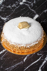 Banana and cream cake. German pie. Banana and cream cake on a dark background. Close up