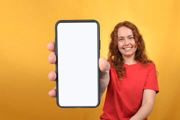Fototapeta na wymiar woman showing smartphone with blank white screen
