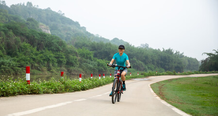 Riding bike in spring forest