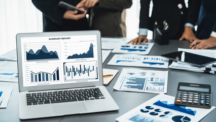 Panorama shot analyst team utilizing BI Fintech to analyze financial report with laptop....