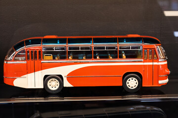 Model of old soviet red bus. Vintage public transport autobus