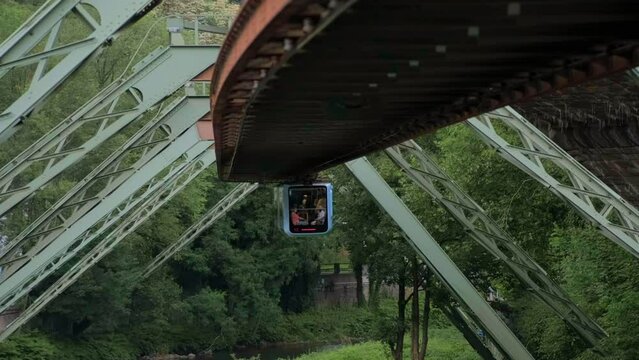 Germany, Wuppertal, Circa 2022. Wuppertal Suspension Railway in front of a train.