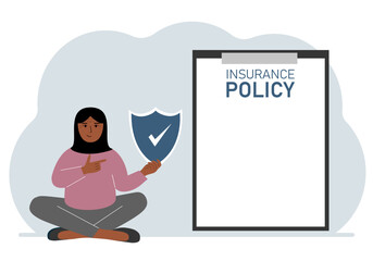 A woman holds an insurance policy sign in his hands. The concept of life insurance, property or natural disasters.