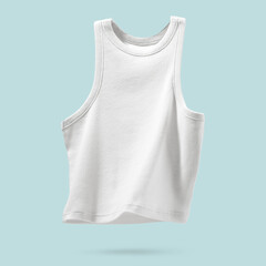 Summer Women's Clothing. Ribbed white tank top flying on light blue background. Female comfortable cotton cloth. Creative template for design Mock up. Copy space