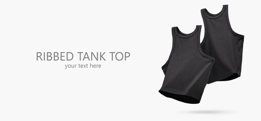 Summer Women's Clothing. Pair Ribbed black tank top flying on light gray background. Female comfortable natural cotton cloth. Creative Advertising for ladies trendy store, blog. Mock up. Copy space