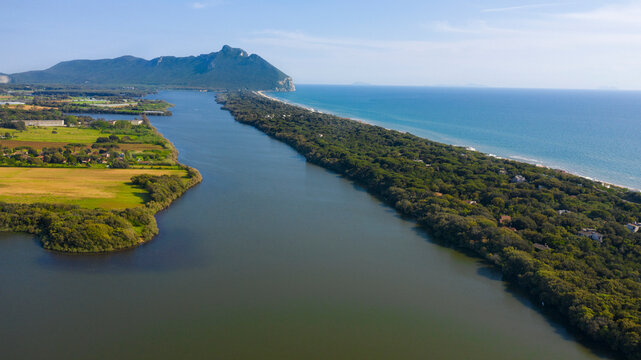 Aerial view of the lake and seafront of Sabaudia, Italy. In the background the Circeo promontory.