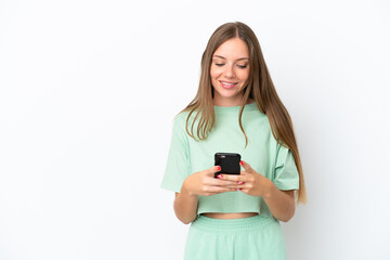 Young Lithuanian woman isolated on white background sending a message with the mobile