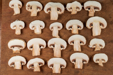 Fresh organic button mushroom forming a beautiful texture pattern background
