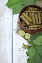Food from grape leaves, tolma doves, mahshi, in a clay pot, grape leaves, background image, background, photo, national food