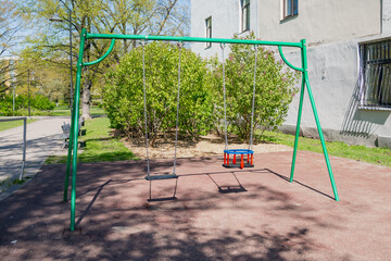 Toddler swing set in side of the park