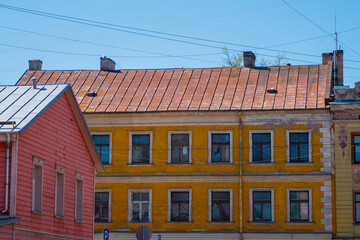 Fototapeta na wymiar Rusty roof on colorful buildings in Europe