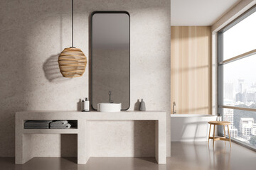 Cozy bathroom interior with sink and tub, accessories and panoramic window
