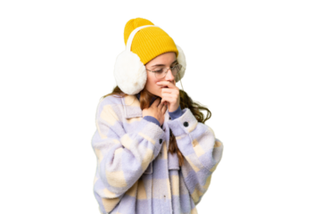 Teenager girl wearing winter muffs over isolated chroma key background is suffering with cough and feeling bad