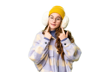 Teenager girl wearing winter muffs over isolated chroma key background smiling with a happy and pleasant expression
