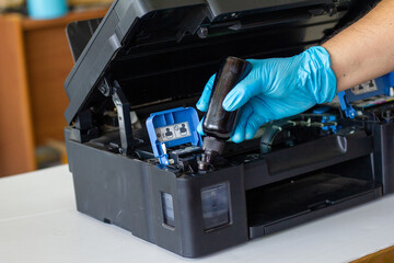 Technicians Refill ink cartridges, printer Inkjet colors.Printer Repairs and Maintenance inkjet or...