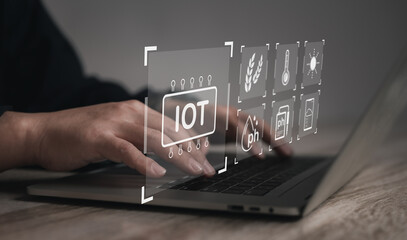 Internet of things (iot) with Smart Farming to develop modern agriculture for Information Technology Integration concept. : businessman is using a computer to control his farm through the Internet.	