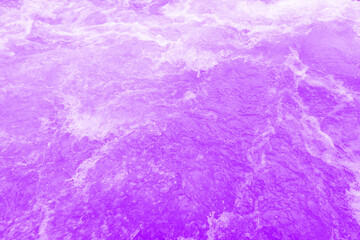 Fototapeta na wymiar Purple water with ripples on the surface. Defocus blurred transparent blue colored clear calm water surface texture with splashes and bubbles. Water waves with shining pattern texture background.