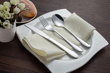 Stainless steel tableware and kitchen utensils placed on the desktop