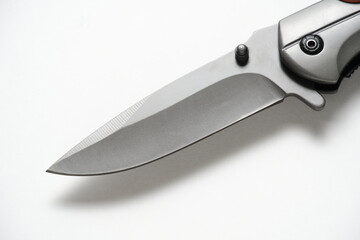 Folding knife blade white background.