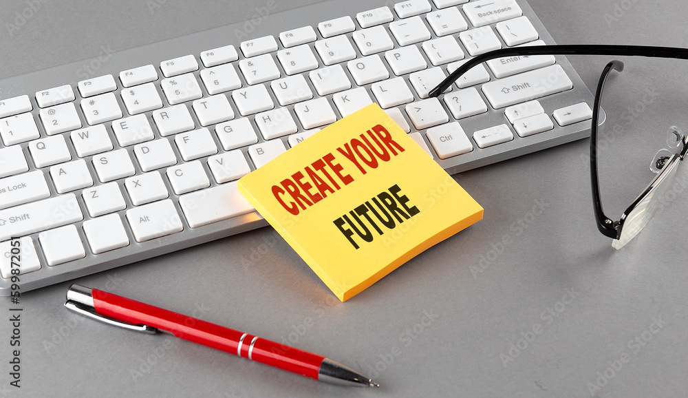 Poster create your future text on a sticky with keyboard, pen glasses on grey background