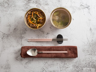 Stainless steel tableware and kitchen utensils placed on the desktop