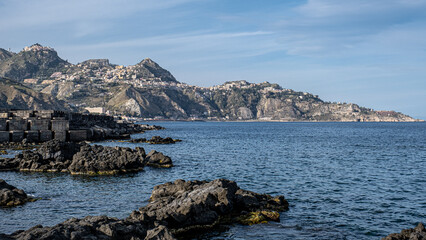 View of Giardini Naxos bay and harbor, situated on the coast of the Ionian sea on a bay between Cape Taormina and Cape Scihso, Sicily, Italy