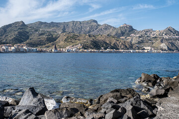 View of Giardini Naxos bay and harbor, situated on the coast of the Ionian sea on a bay between...