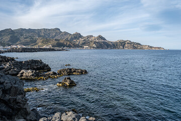 Fototapeta na wymiar View of Giardini Naxos bay and harbor, situated on the coast of the Ionian sea on a bay between Cape Taormina and Cape Scihso, Sicily, Italy