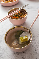 Stainless steel tableware and kitchen utensils placed on the desktop