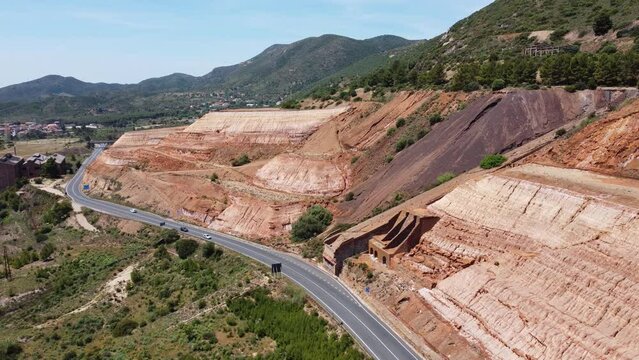 monteponi mine - aerial view of the red mud and the ruins of the old monteponi mine in Iglesias in southern Sardinia
