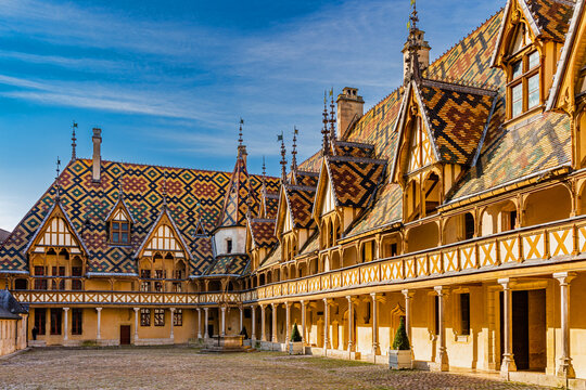 Beaune, France; April 18, 2023: The Hospices de Beaune or H&ocirc;tel-Dieu de Beaune is a former charitable almshouse in Beaune, France