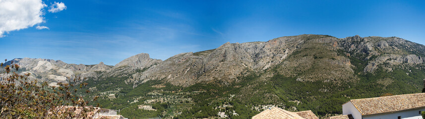 large panorama with nice weather and sunshine in guadalest in spain