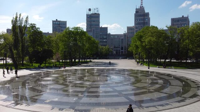 Aerial Derzhprom building with fountain and green park in spring on Freedom (Svobody) Square in Kharkiv city center, Ukraine