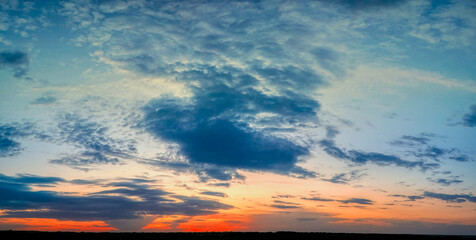 Naklejka na ściany i meble panorama of a beautiful sunset in the sky