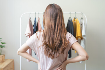 Young beautiful women choose dress-up clothes to wear at home.