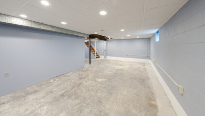 unfinished basement has had water damage repaired and has been professionally waterproofed