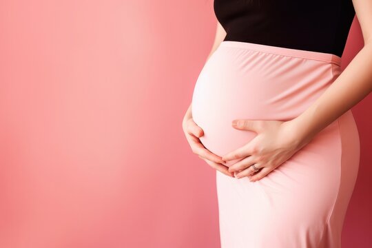 A pregnant caucasian woman strokes her belly on red background. Place for text. Copy space. Waiting for the birth of a child. High quality photo Generative AI