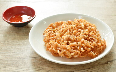 batter-fried prawn in flour and egg dipping sweet sauce on plate
