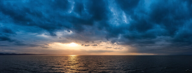 Cloudy Cloudscape during stormy everning on the West Coast of Pacific Ocean. British Columbia, Canada. Sunset Sky. Panorama