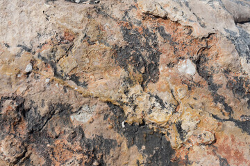 natural weathered red brown and black rock texture abstract background