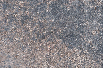 Granite surface close up. Granite stone texture background. Detail of granite stone surface.