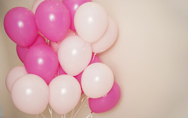 Fototapeta na wymiar Bunch of multi-coloured balloons. Pink and light pink with background space for text. 