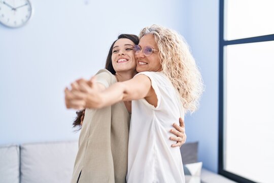 Two Women Mother And Daughter Dancing At Home