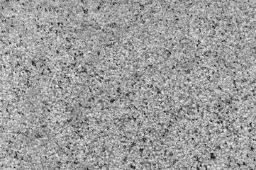 Granite surface close up. Granite stone texture background. Detail of granite stone surface.
