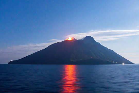 Stairway to the Volcano as seen by the reflection of a volcanic eruption from the Stromboli Volcano in Italy.
This photo was photographed from the deck of a cruise ship as we sailed by.