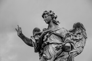 Fototapeta na wymiar Statue on Ponte Sant'Angelo, in Rome, Italy 