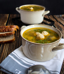 Soup close-up. Soup with meatballs. On a wooden background.